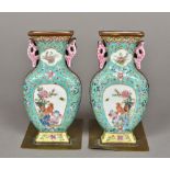 A pair of Chinese bronze mounted porcelain bookends Modelled as twin handled baluster vases