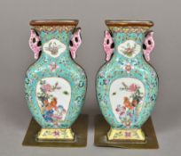 A pair of Chinese bronze mounted porcelain bookends Modelled as twin handled baluster vases