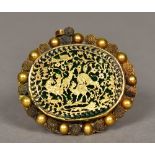 A 19th century Indian unmarked gold pendant brooch Of oval form,