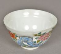 A Chinese eggshell porcelain tea bowl The exterior decorated in the round with birds amongst