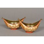 A pair of Kashmiri brass and papier mache bowls Each of navette form with floral decoration on a