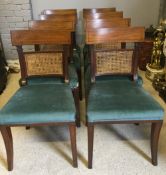 A set of eight early 19th century mahogany line inlaid dining chairs Each with carved centre panel,