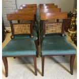 A set of eight early 19th century mahogany line inlaid dining chairs Each with carved centre panel,