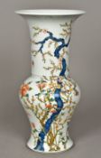 A Chinese porcelain vase Decorated with bats amongst prunus blossoms,
