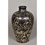 A Chinese Jizhou Guri style vase Decorated with ruyi scrolls on a dark black/brown ground,