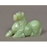 A Chinese carved jade horse Modelled recumbent. 9.5 cm long.