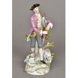 A 19th century Meissen porcelain figure of a bagpiper Modelled before a tree stump with a dog and a