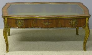 A late 19th century gilt metal mounted walnut vitrine The glazed hinged serpentine top above the