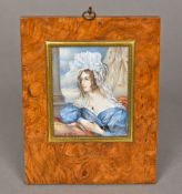 A miniature portrait Depicting a young lady wearing a blue dress,