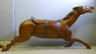 A large stained wooden model carousel horse Typically modelled galloping.