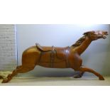 A large stained wooden model carousel horse Typically modelled galloping.