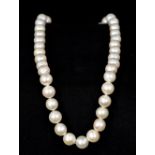 A pearl bead necklace Set with a 14 K gold clasp. 41.5 cm long.