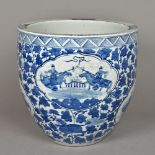 A Chinese blue and white porcelain jardiniere Decorated in the round with warring figural vignettes