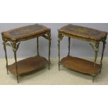 A pair of bronze mounted side tables Each shaped top centred with musical trophies,