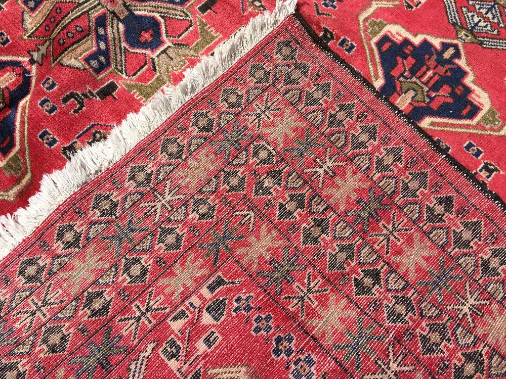 A Turkman wool carpet The wine red field enclosing stylised foliate strings within geometric guard - Image 2 of 2