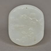 A Chinese carved jade pendant Worked with a sage reclining in a river landscape opposing archaistic