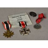 A group of three German World War II medals Including: an 1813-1939 Iron Cross,