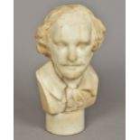 A Victorian carved marble bust Modelled as William Shakespeare, mounted on a circular socle.