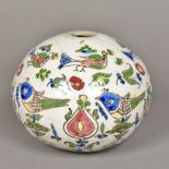A Persian pottery hanging sphere Decorated with birds amongst floral sprays. 14 cm high.