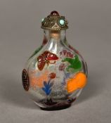 A Chinese Peking cameo glass snuff bottle Decorated with a cat and butterflies. 6.5 cm high.