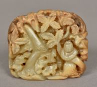 A Chinese carved white and russet jade b