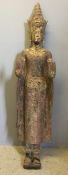 A large Cambodian polychrome decorated carved wood standing Buddha 168 cm high.