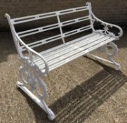 A white painted cast iron garden bench,