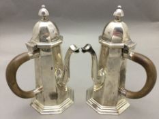 A pair of Victorian silver chocolate pot