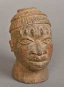 An African terracotta model of a male bu