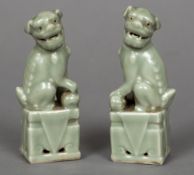 A pair of Chinese celadon dogs-of-fo Ea