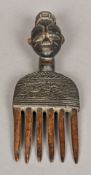 An African tribal carved wooden comb Th