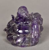 A Chinese carved amethyst Buddha