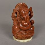 A carved gold stone figure Ganesh