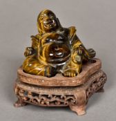 A Chinese carved tiger's eye Buddha