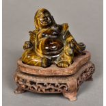 A Chinese carved tiger's eye Buddha