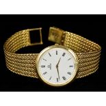 An 18 ct gold Omega gentleman's wristwatch The white dial with Roman numerals,