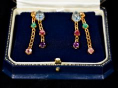 A pair of unmarked 14 ct gold emerald, a