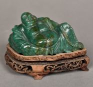 A Chinese carved green stone Buddha