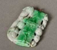 A Chinese carved jade pendant Formed as