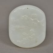 A Chinese carved jade pendant Worked wi