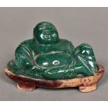 A Chinese carved green stone Buddha