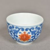 A miniature Chinese porcelain tea bowl