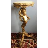 A 19th century carved giltwood torchere