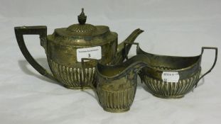 A silver three piece bachelors tea set