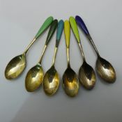 A set of enamel decorated teaspoons