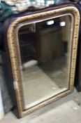 A Victorian inlaid and decorated wall mirror