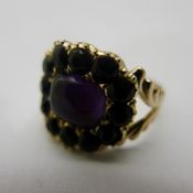 A Georgian yellow metal, amethyst and jet mourning ring,