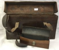 A leather shotgun cartridge case;