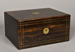 A 19th century brass inlaid coromandel writing box Enclosing a typically fitted interior.