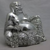 A silvered coloured model of a seated Buddha